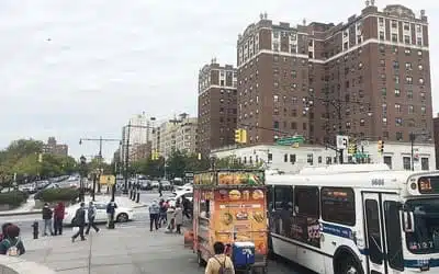 First Up Cleaing Services serves Bronx, New York with large buildings, food cart, and bus at bus stop